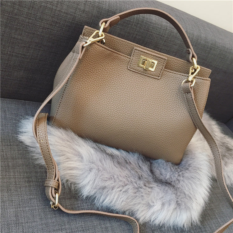 Stylish Women's Cat Bag with Gold Lock Closure